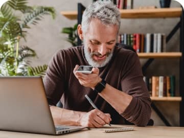 Man making a phone call at desk